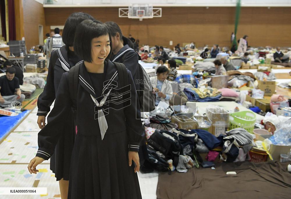 Students head to school from shelter