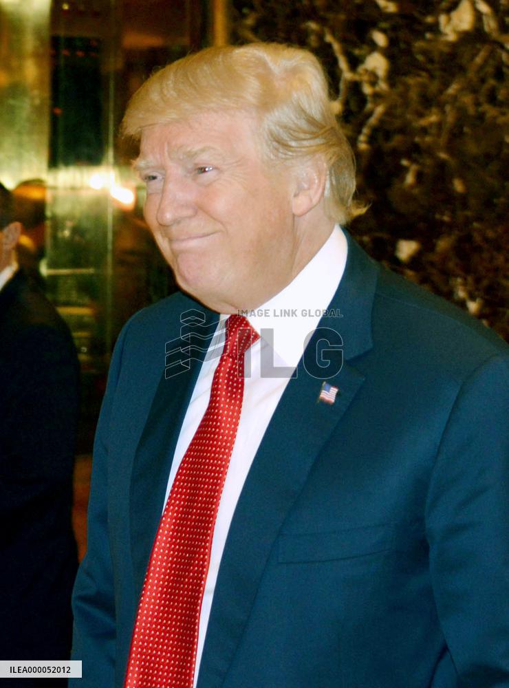 Trump calls U.S. dollar "too strong," hints at weak-dollar policy