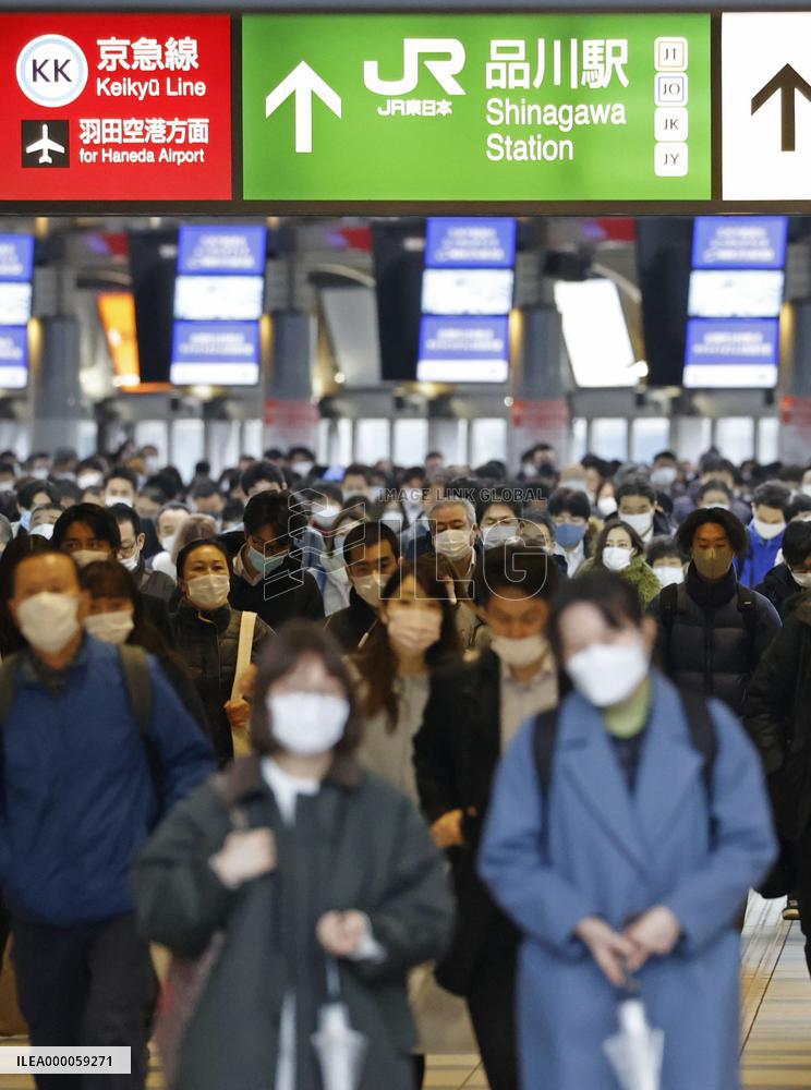 Japan to extend virus emergency to March 7 as hospitals strained