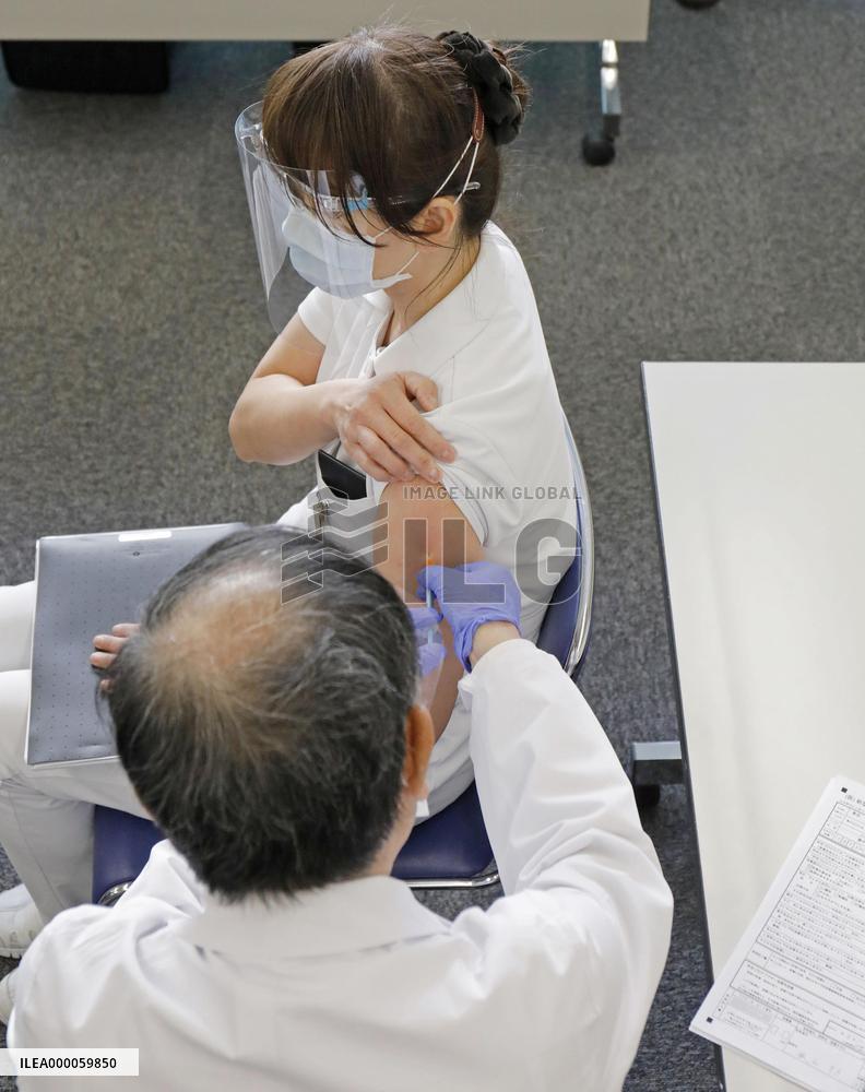 Japan begins COVID-19 vaccine to health workers