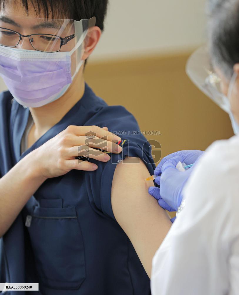 Japan begins COVID-19 vaccine to health workers