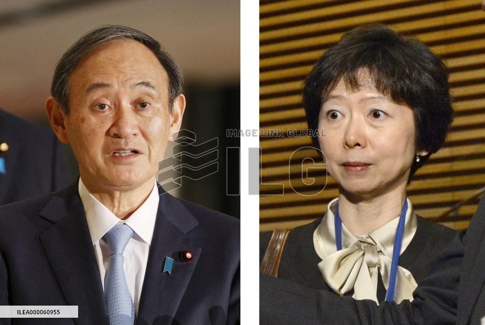 Japan PM Suga, press official who quit over scandal involving his son