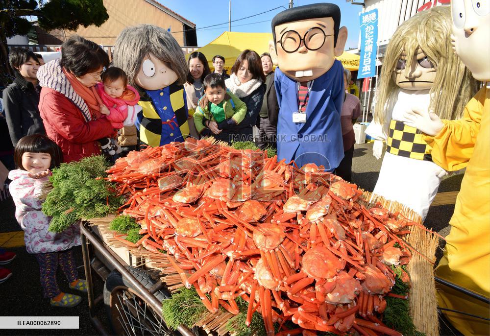 Crabs displayed on cart drawn by specter cartoon characters