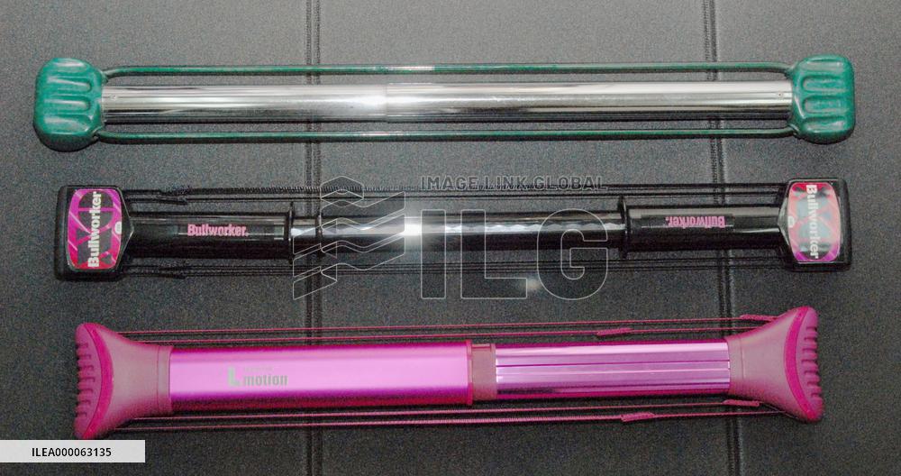 Old, new models of 'Bullworker' fitness device shown together