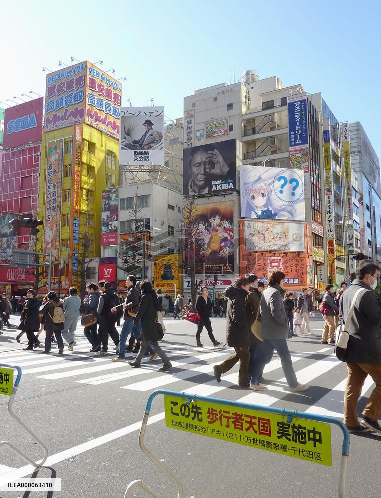 People walk in Tokyo's Akihabara district, scene of stabbing spree