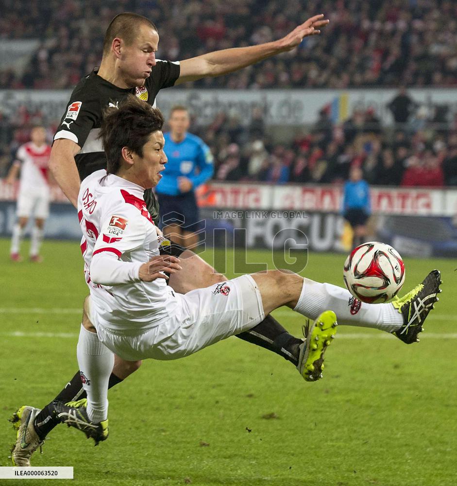 Japan forward Osako of Koln competes for ball in game vs. Stuttgart