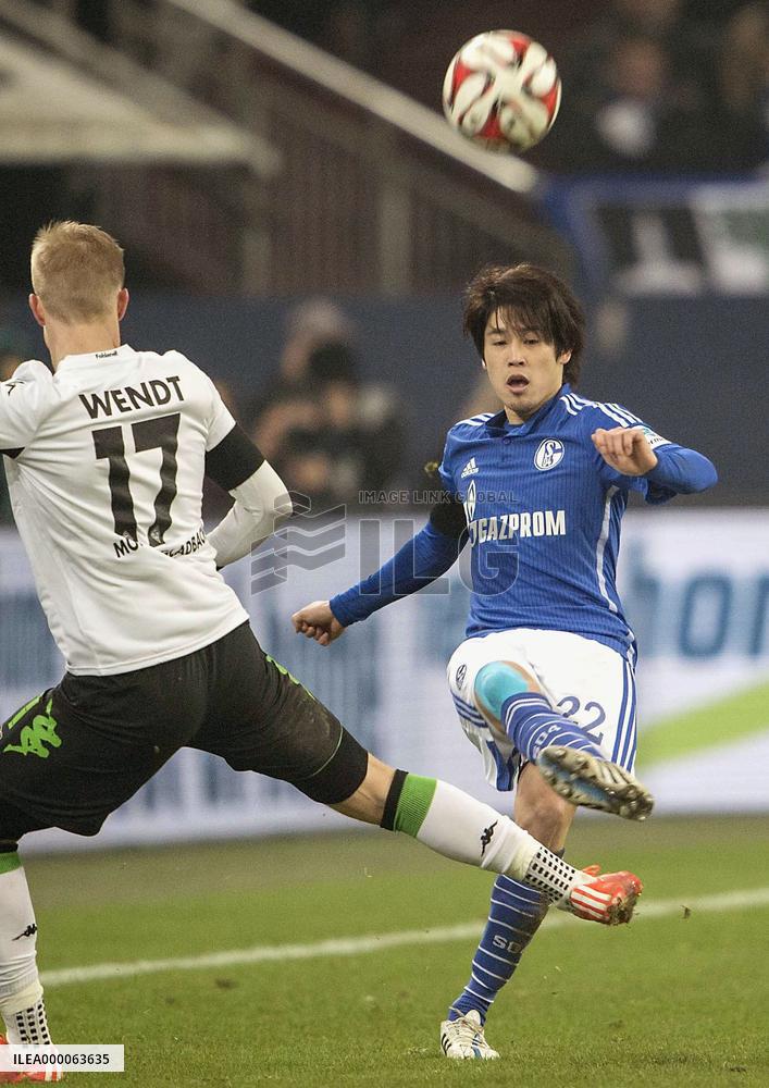 Japanese defender Uchida of Schalke makes pass in Bundesliga match