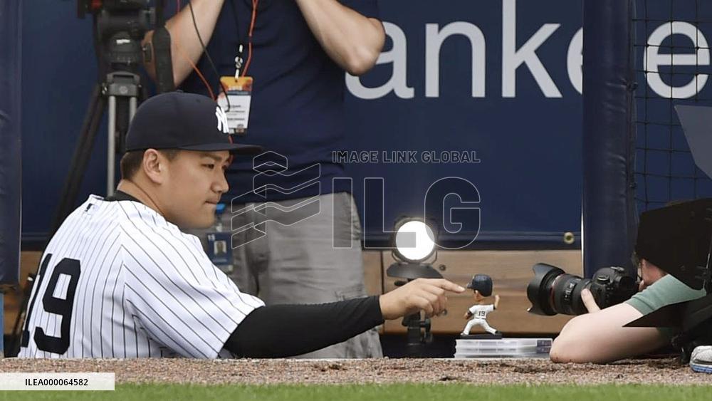 Tanaka shoots bobblehead doll promotional video