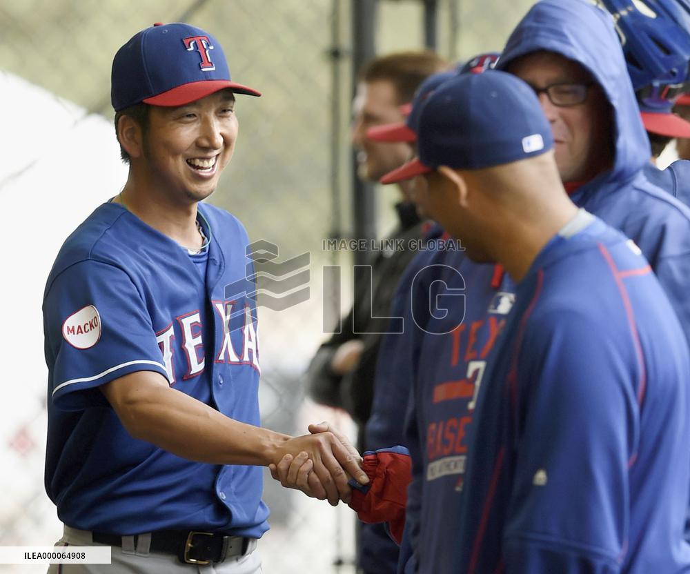 Rangers pitcher Fujikawa shakes hands with teammate