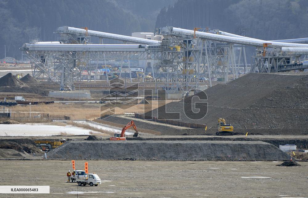 Giant conveyors in operation on site bulldozed after 2011 tsunami