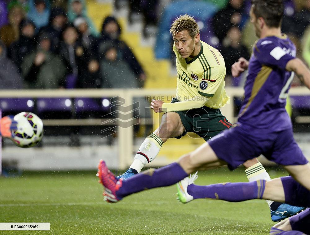 Japan MF Honda of AC Milan shoots in game against Fiorentina