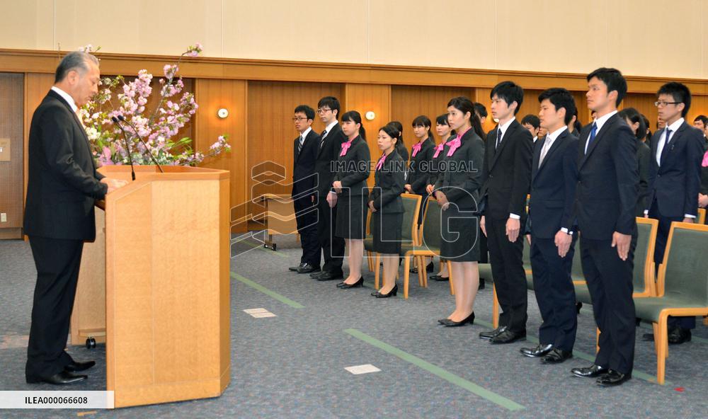 Japanese firms welcome new faces at start of business year