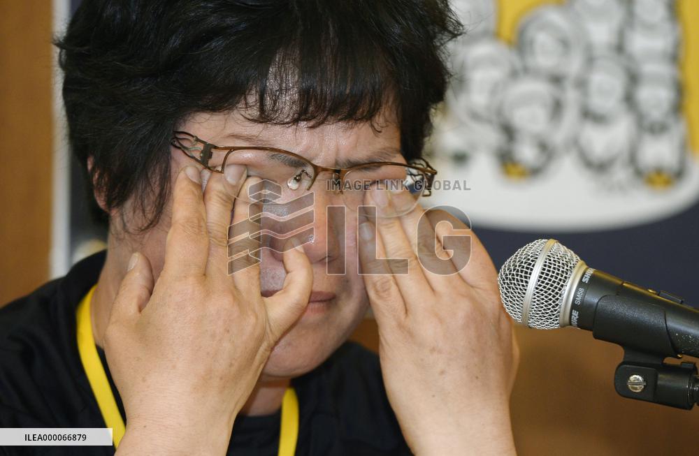 Mother of missing ferry disaster victim urges gov't to salvage wreckage