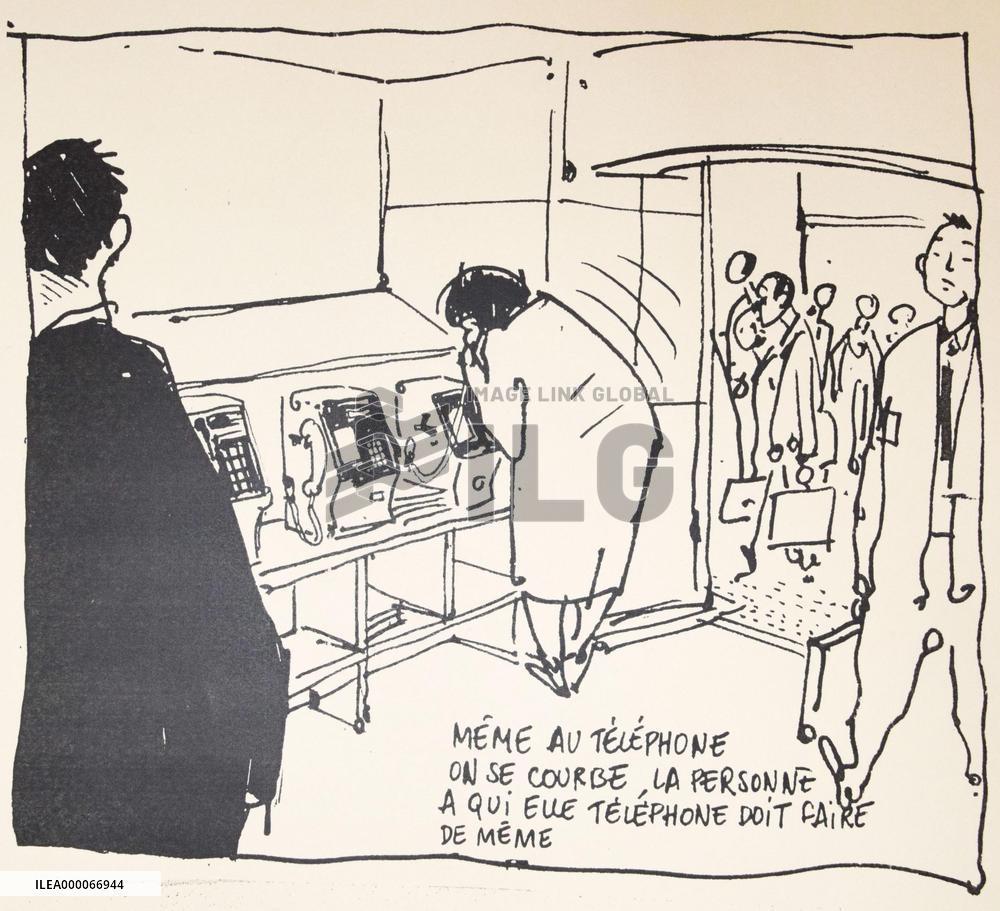 Woman bowing on phone among Verlhac's cartoons on show in Fukuoka