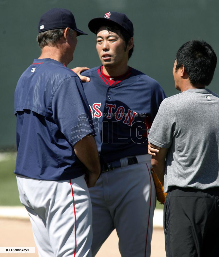 Japanese pitcher Uehara of Red Sox speaks with manager Farrell