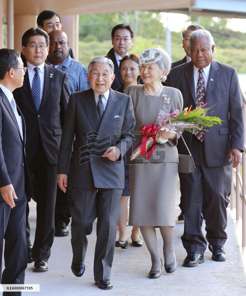 Palauans welcome imperial couple, wave Japanese flags