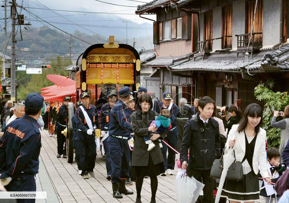 People pull carriage as part of temple festival in western Japan