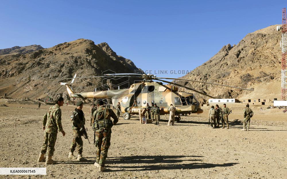 Afghan soldiers stand guard near Remains of Jam