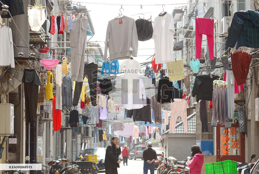 Laundry hung above Shanghai backstreets
