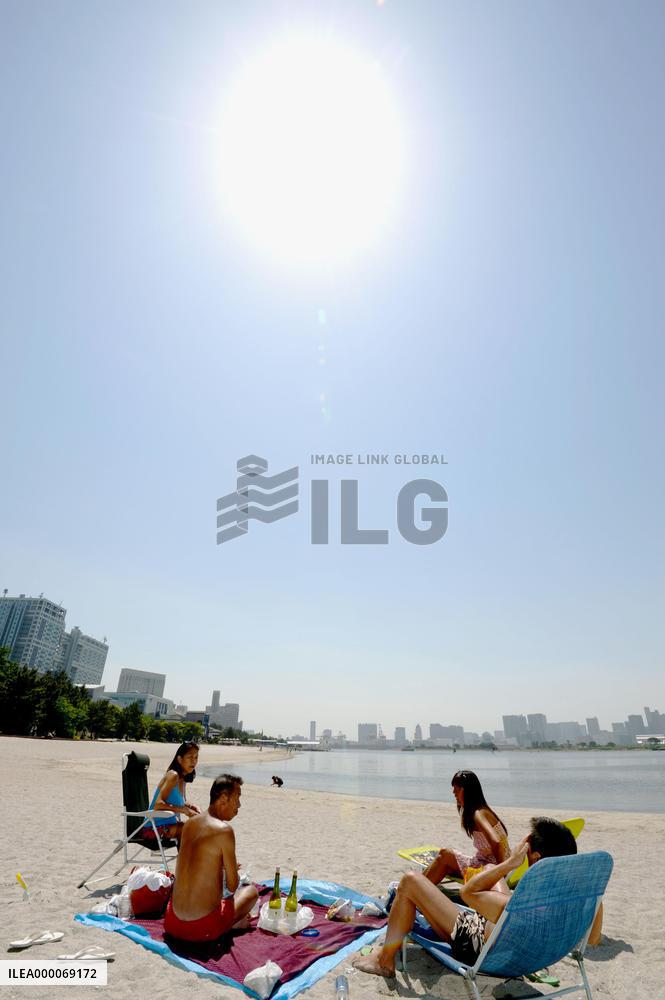 Sunbathing in Tokyo seaside park