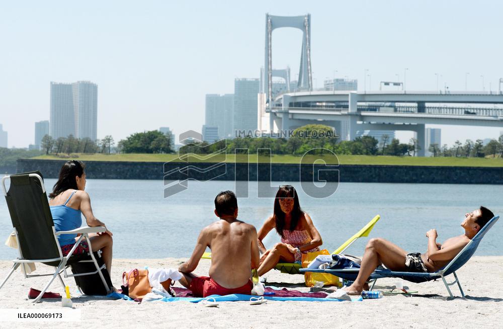 Sunbathing in Tokyo seaside park