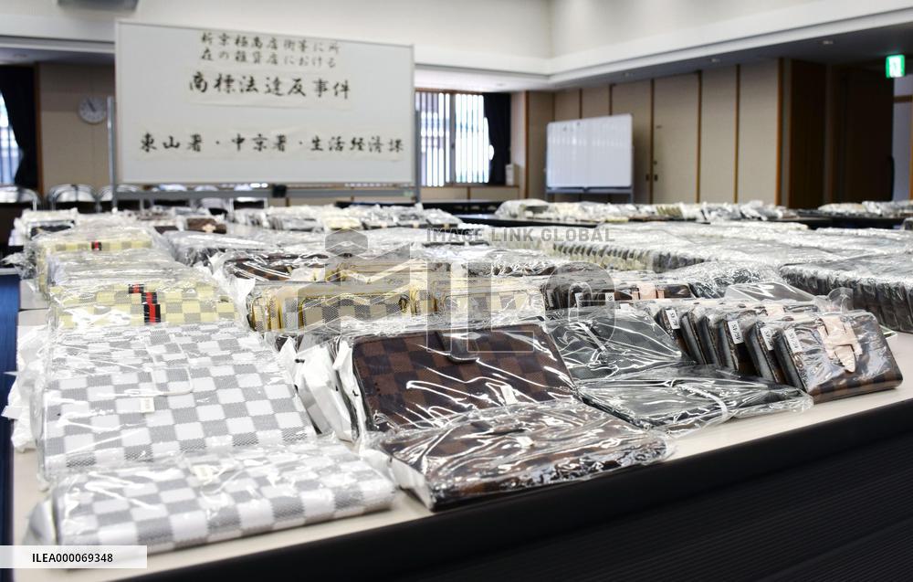 Kyoto police shows confiscated fake Louis Vuitton smartphone cases