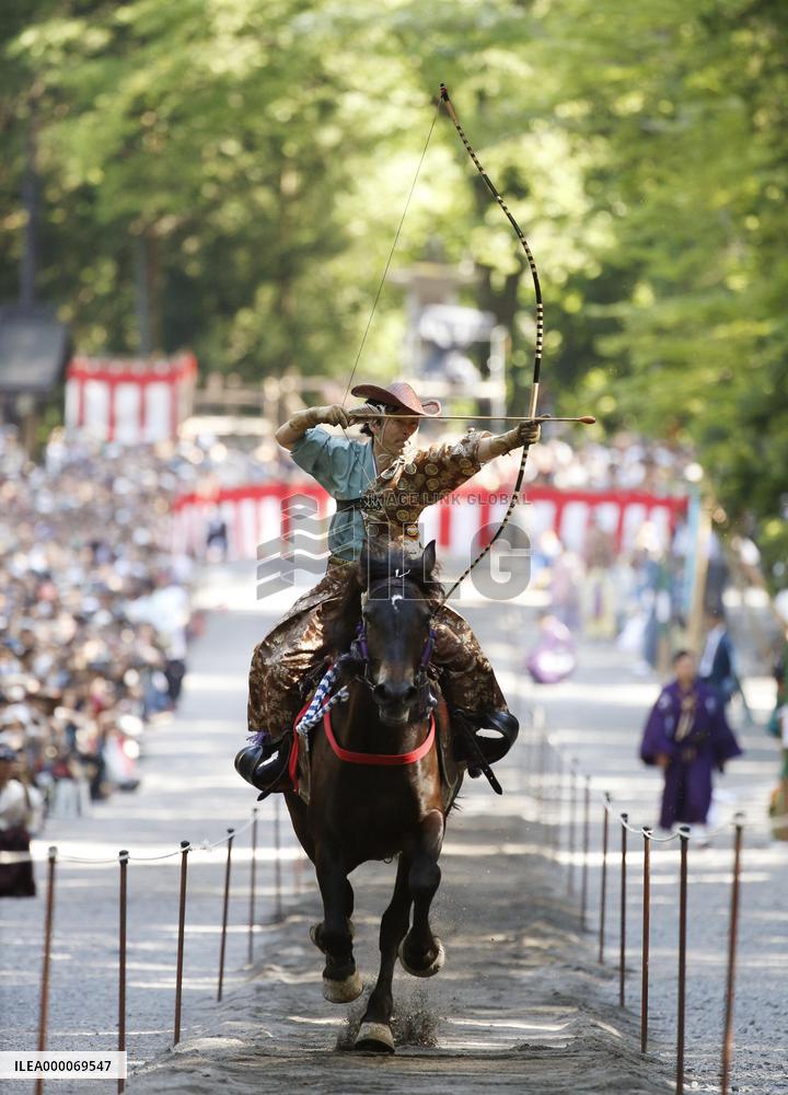 Archer on horseback in action to mark anniv. of shrine founder's death