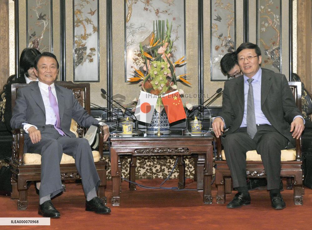 Deputy PM Aso meets China's Finance Minister Lou in Beijing
