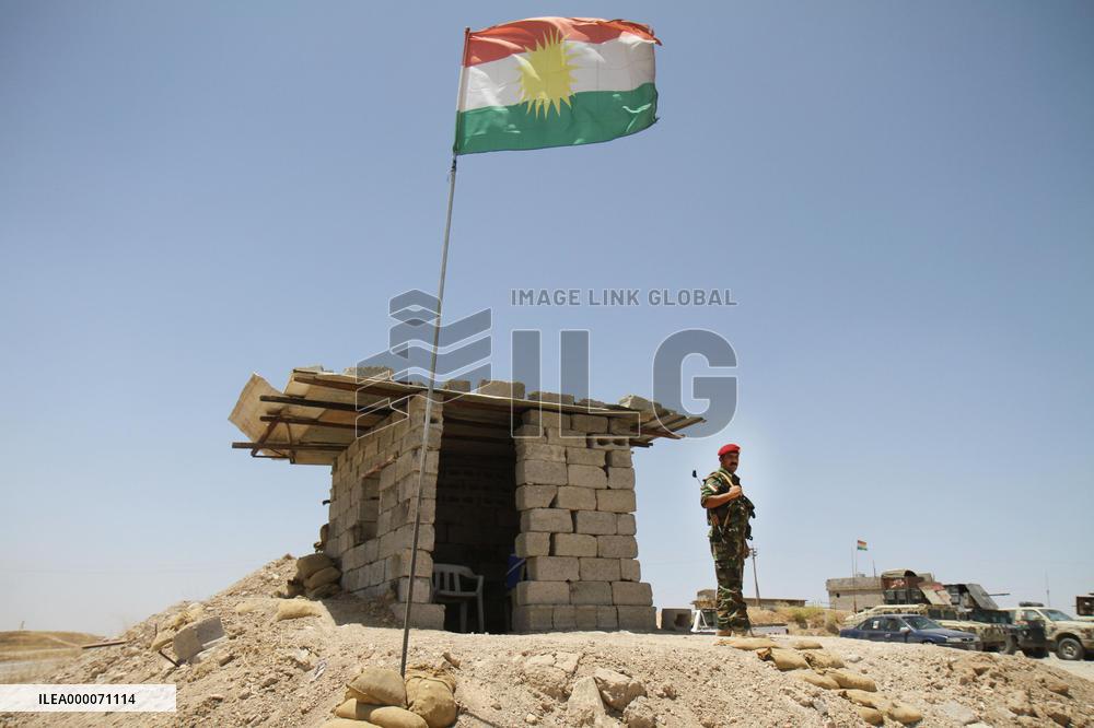 Kurdish regional gov't flag fluttering in northern Iraq