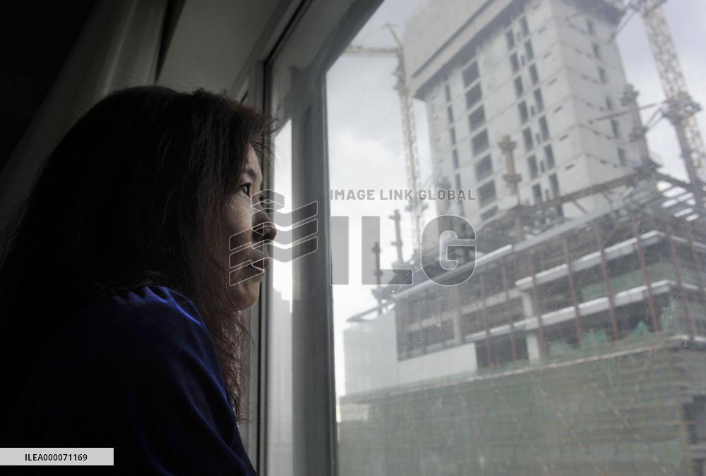 Beijing woman says her house expropriated without due process of law