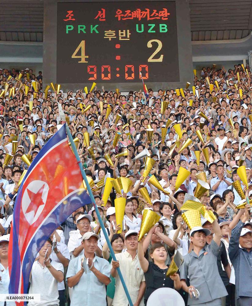 North Koreans cheer for World Cup qualifier vs Uzbekistan