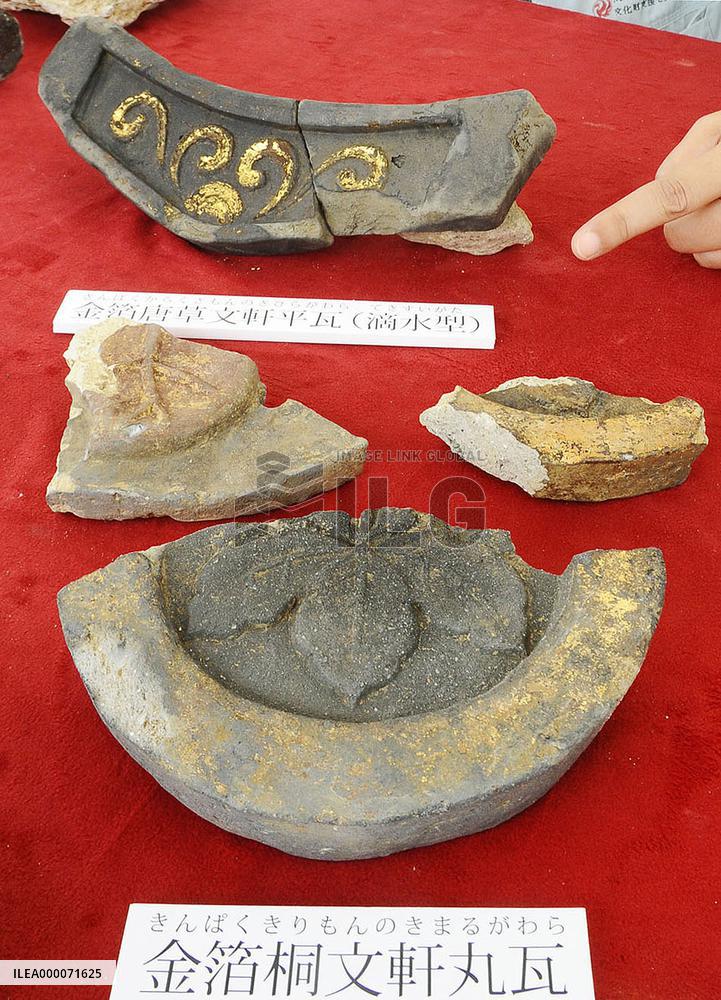Gold-plated roof tiles seen as ruins of feudal warlord's castle