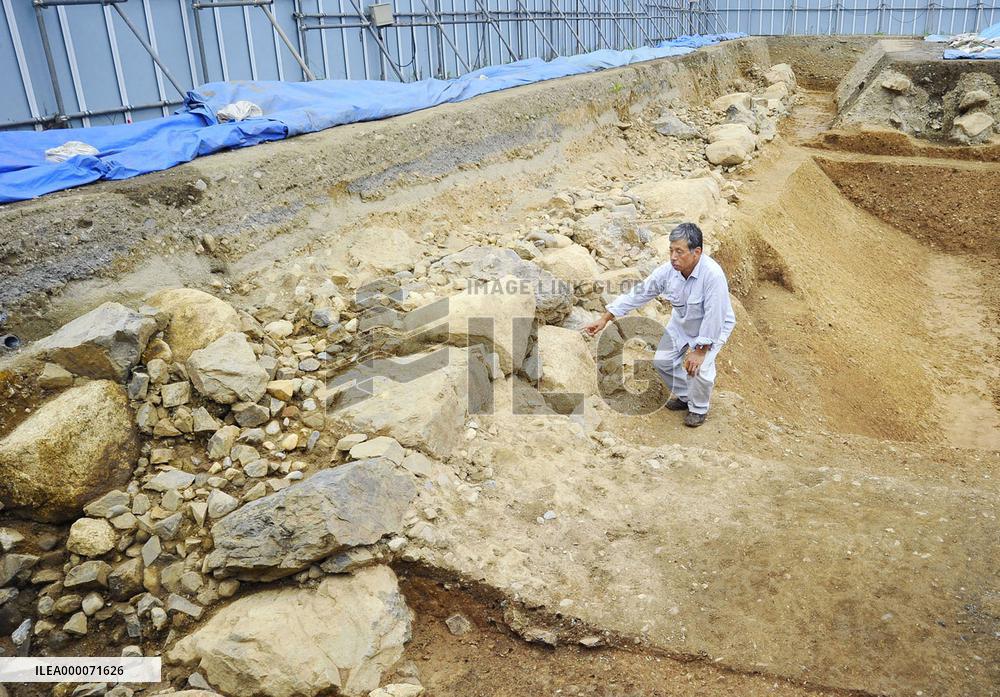 Gold-plated roof tiles apparent ruins of feudal warlord's castle