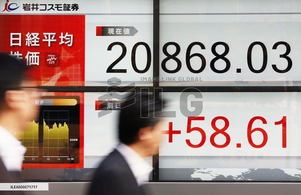 Nikkei ends at 18-yr high