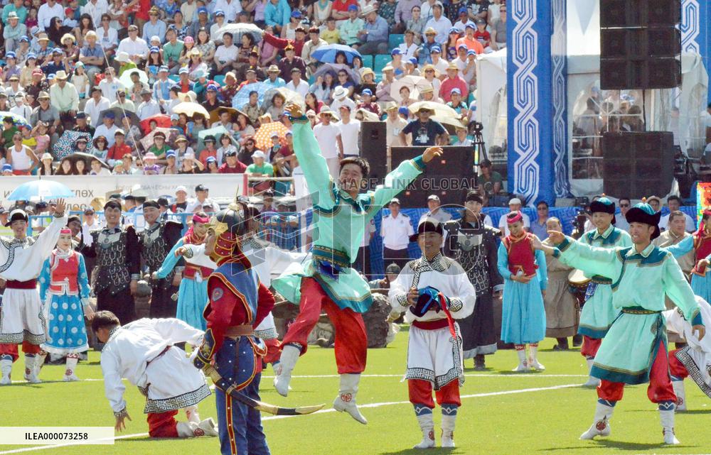 People dance during opening ceremony for sport festival in Mongolia