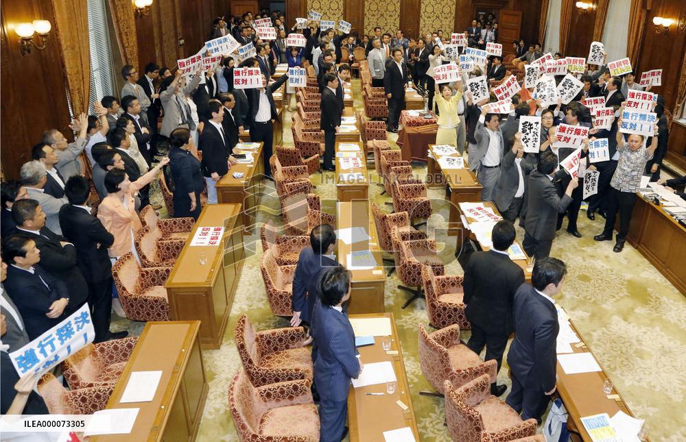 Japan ruling camp rams security bills through Diet panel
