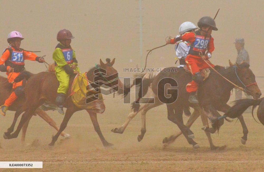 Mongolian children compete in colt race at summer sport festival