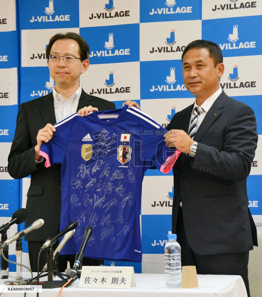 Japan women's soccer team coach gives jersey to Fukushima governor