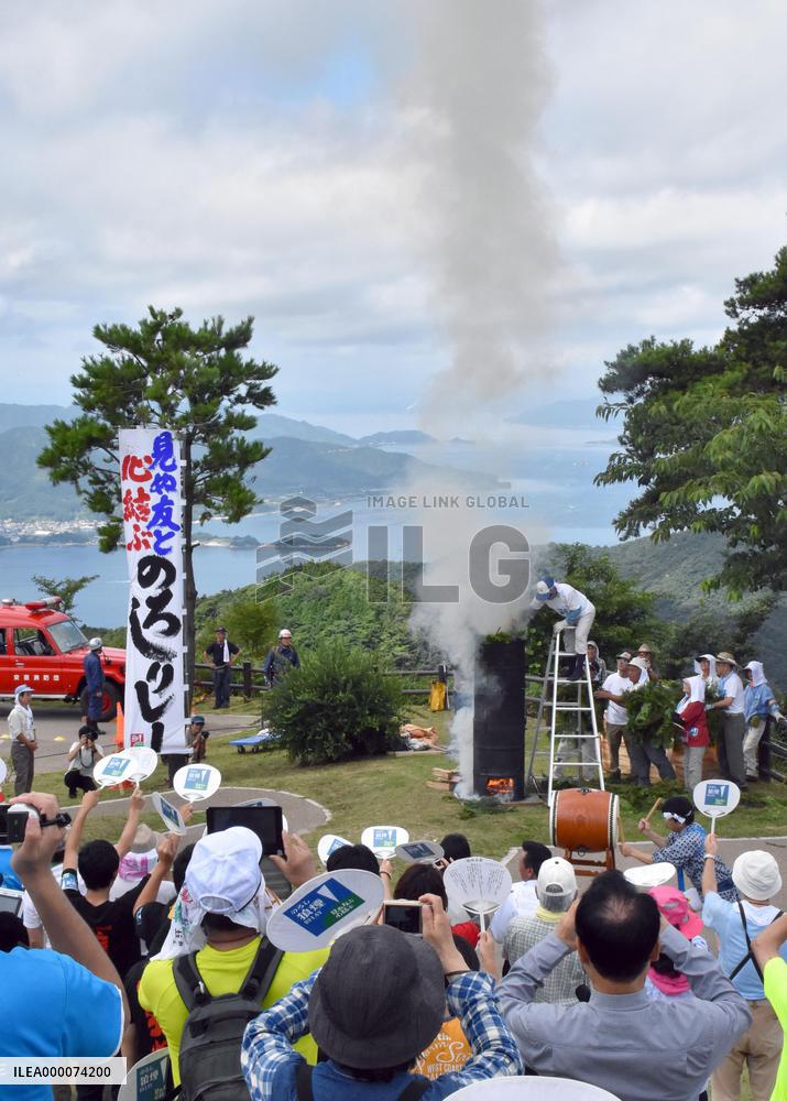 Beacon fire lit in Hiroshima as part of nationwide smoke signal event