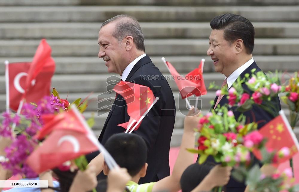 Turkish President Erdogan visits China, greeted by Xi