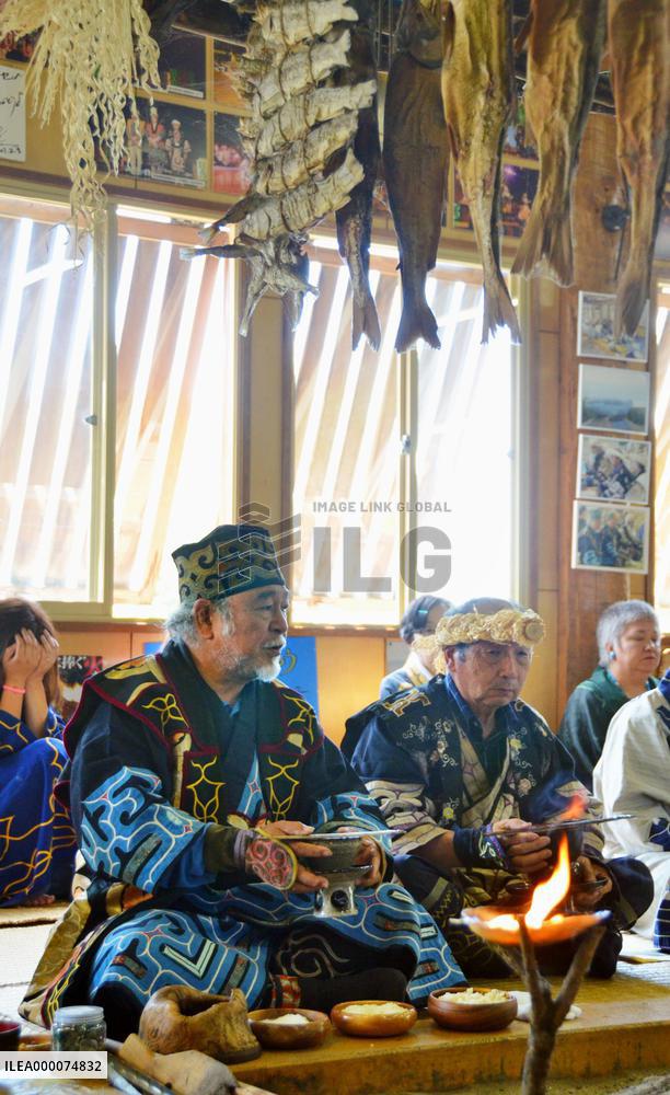 Ainu people pray to fire god in commemoration of ancestors