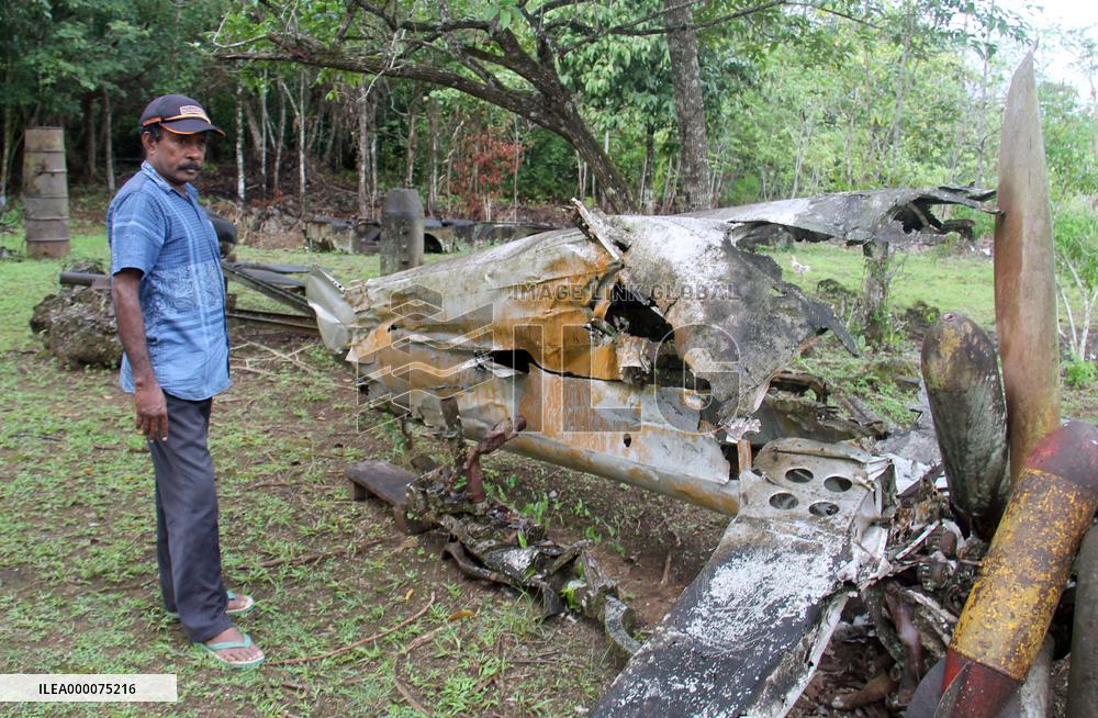 Landowner stands by wreckage of WWII plane on Biak