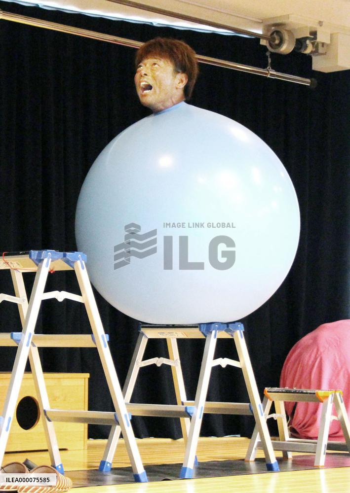 Japanese performer inside balloon
