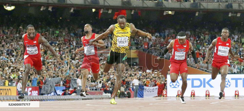 Bolt edges Gatlin to retain world 100-meter title