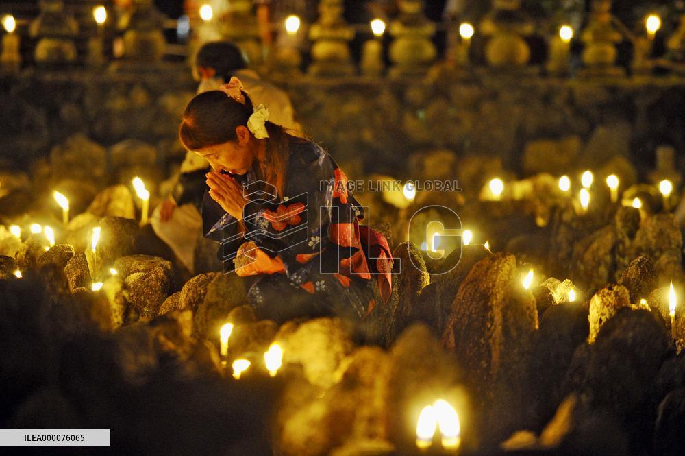 People pray for souls of forlorn dead at Kyoto temple