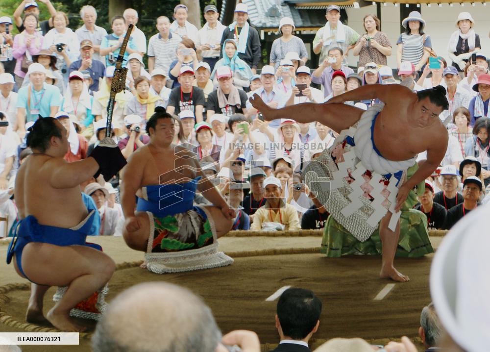 Yokozuna Harumafuji in ceremonial action at shrine in northern Japan