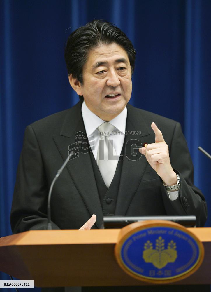 Japan PM Abe retains key ministers in Cabinet reshuffle