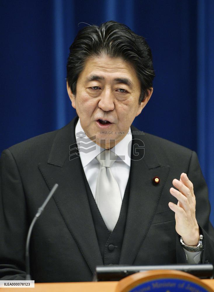 Japan PM Abe retains key ministers in Cabinet reshuffle