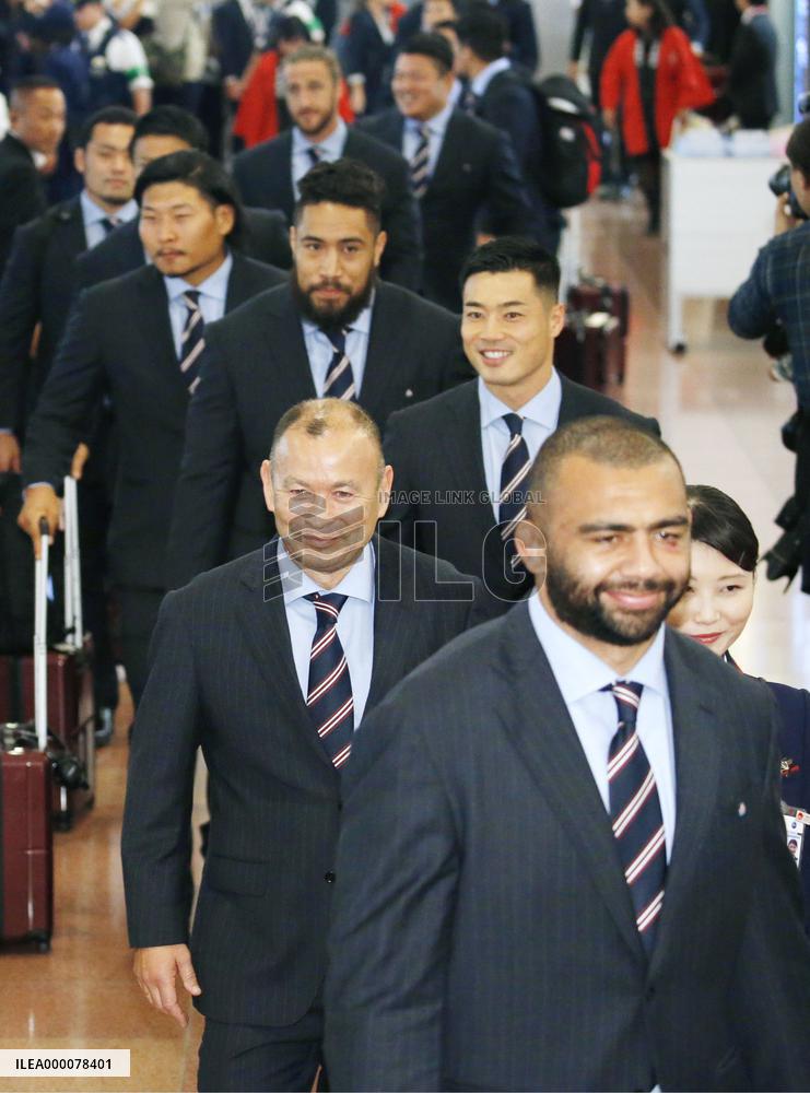 Japan rugby team returns home