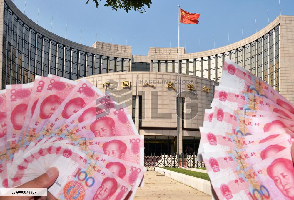 China cuts benchmark interest rates amid economic slowdown